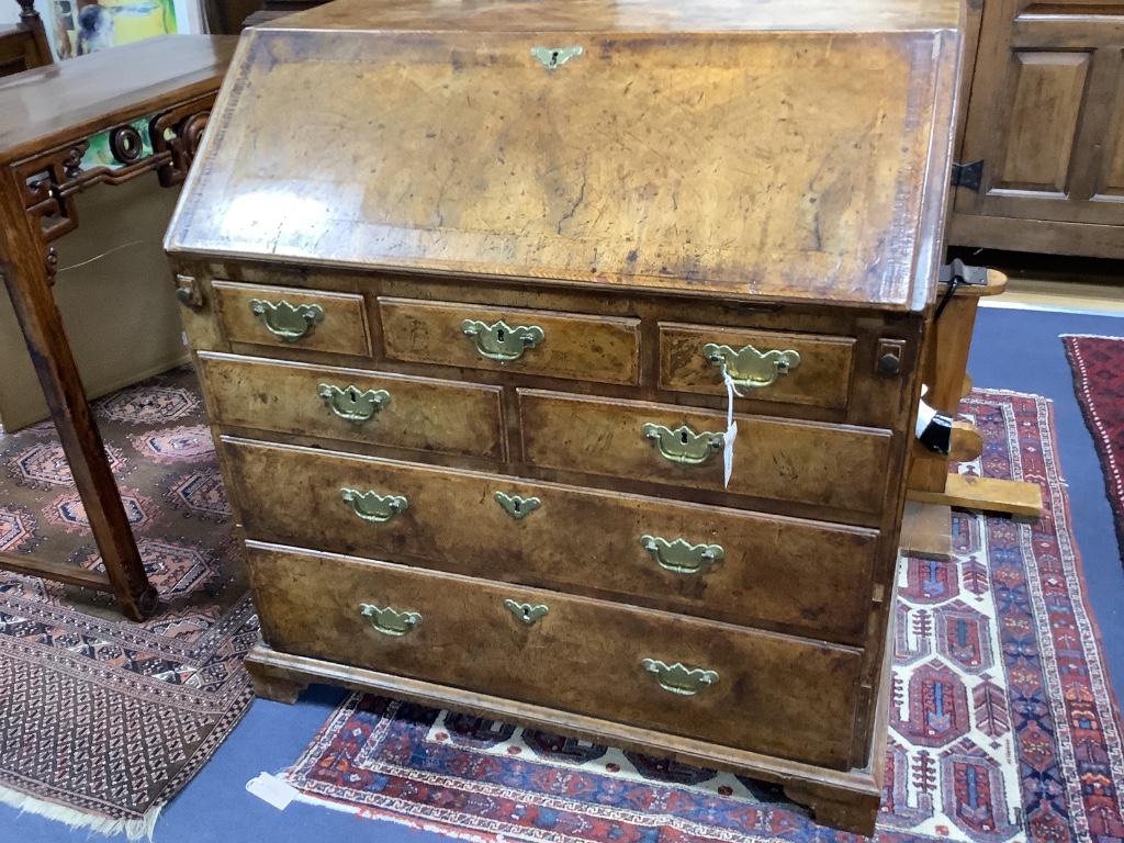 A George II walnut bureau, width 91cm depth 52cm height 97cm